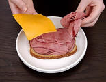 image of a meat and cheese on a plate