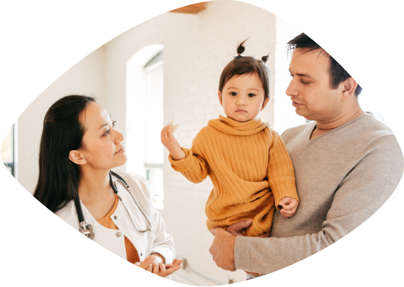 African American father and young daughter are laughing and jumping in their living room