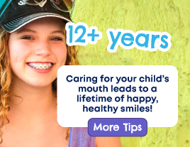 A close-up of a young, smiling, teenage girl with braces